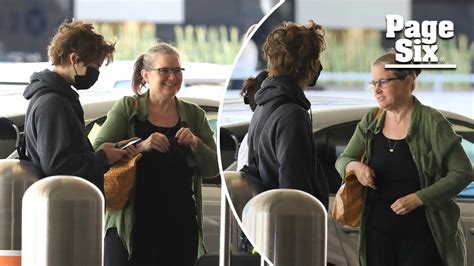 Bridget Fonda arrives at LAX with son Oliver Elfman in rare sighting